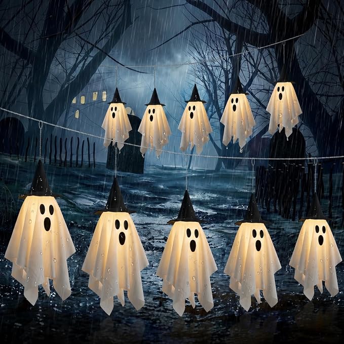 Ghost string lights with little witch hats, glowing softly in a row.