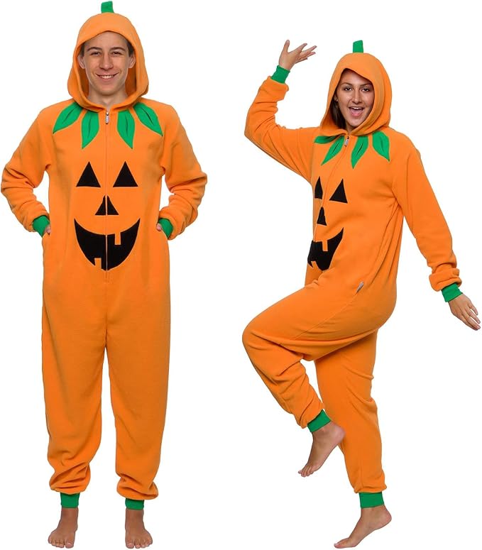 Two adults wearing hooded orange jack-o-lantern pumpkin onesies with green cuffs and leaf collars.