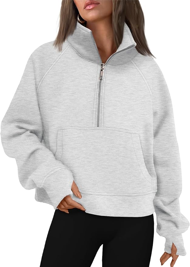 Light gray half zip fleece pullover with a stand collar and front pocket.