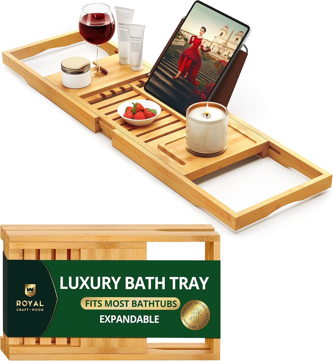 Expandable bamboo bathtub tray caddy holding a wine glass, tablet, and candle.