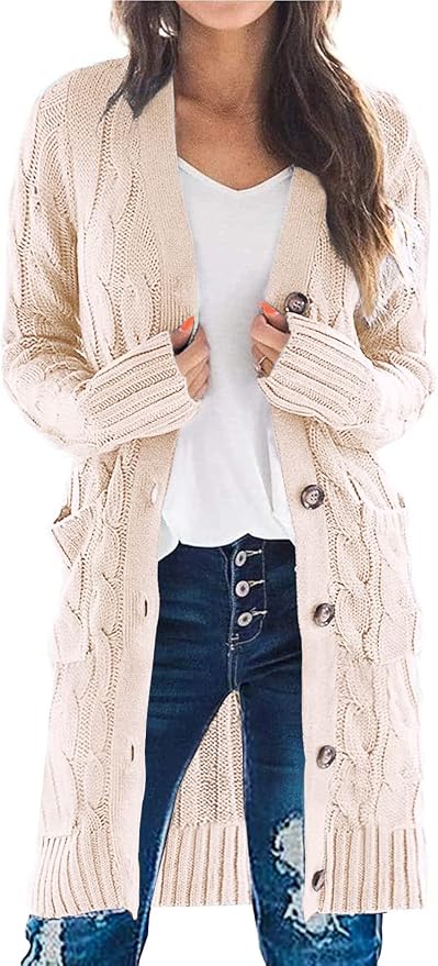 Woman wearing a long beige cable knit button cardigan over a white tee and jeans.