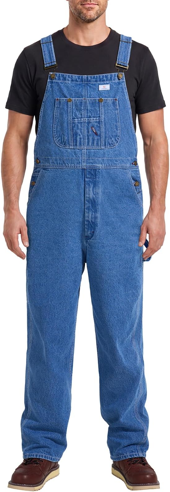 Medium wash denim bib overalls with a chest pocket and adjustable straps.