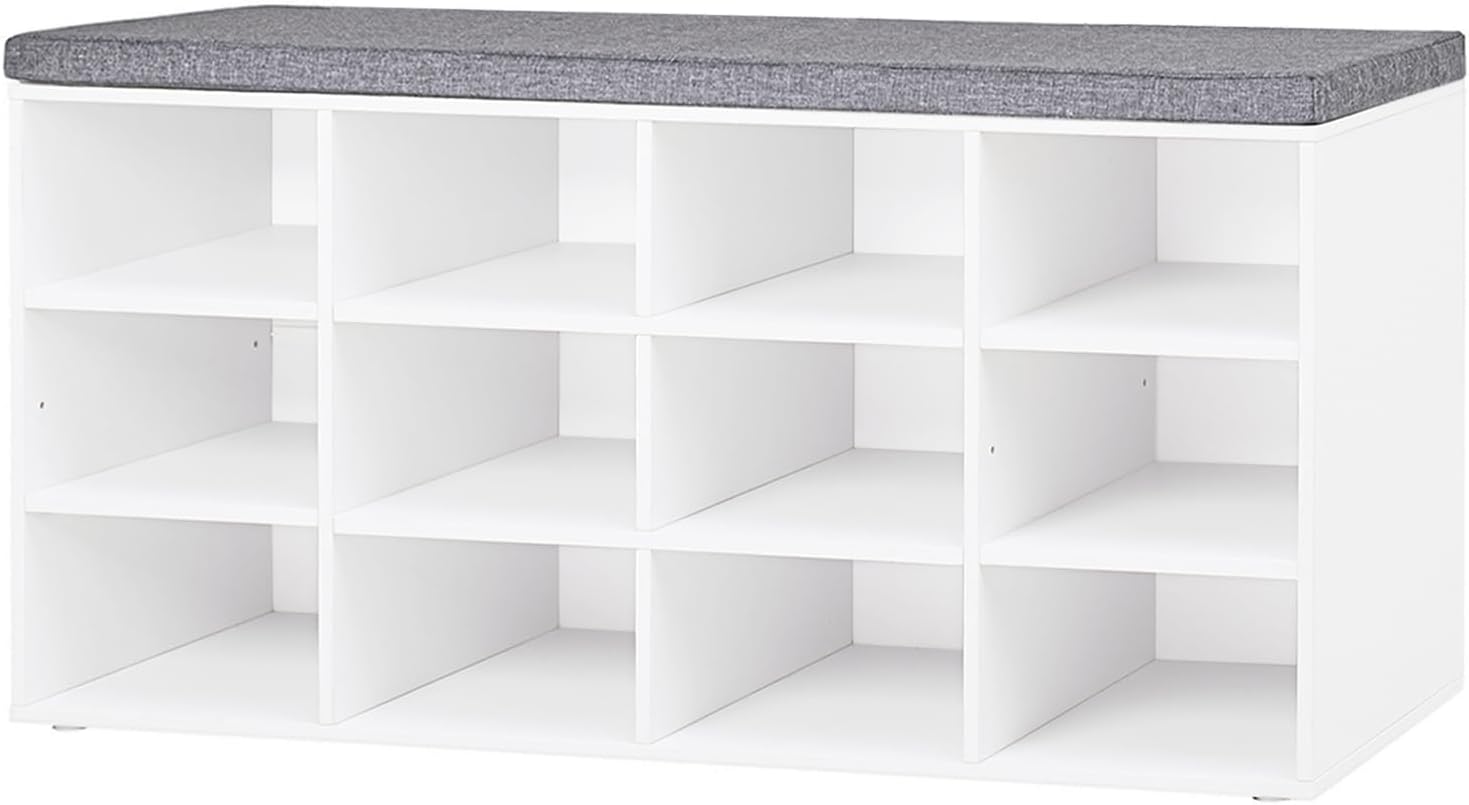 White shoe storage bench with twelve open cubbies and a gray cushioned seat top.
