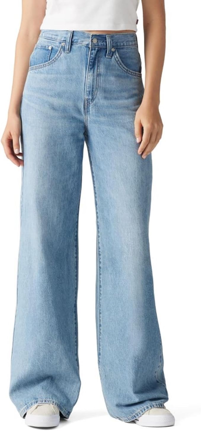 Light wash high waisted wide leg jeans on a model.