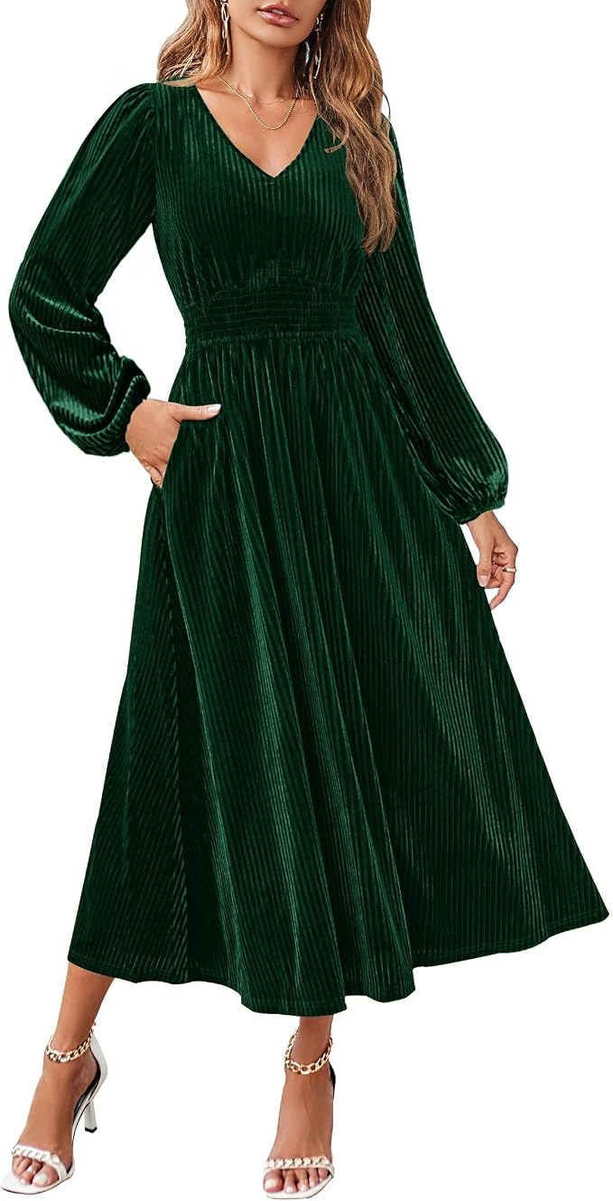 Woman wearing a long sleeve green ribbed velvet midi dress with smocked waist.
