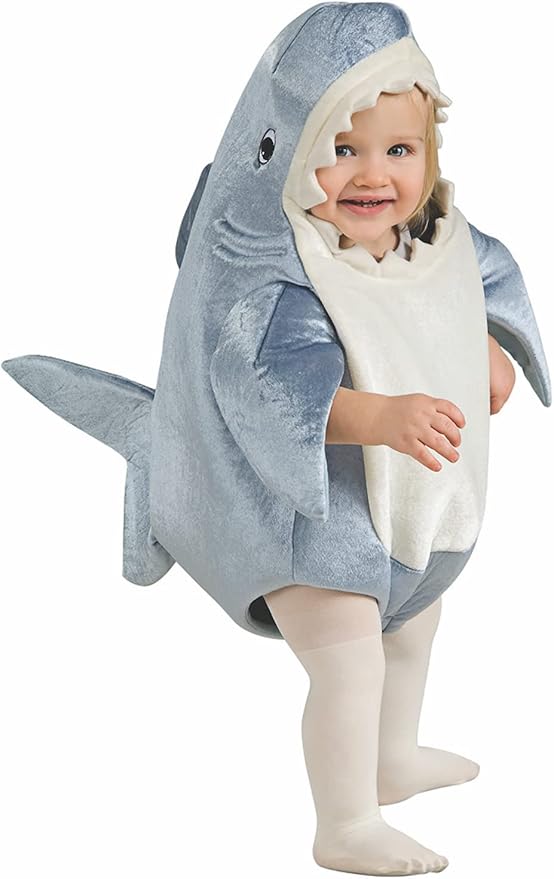 Toddler wearing a plush grey shark bunting costume with a cream belly panel.
