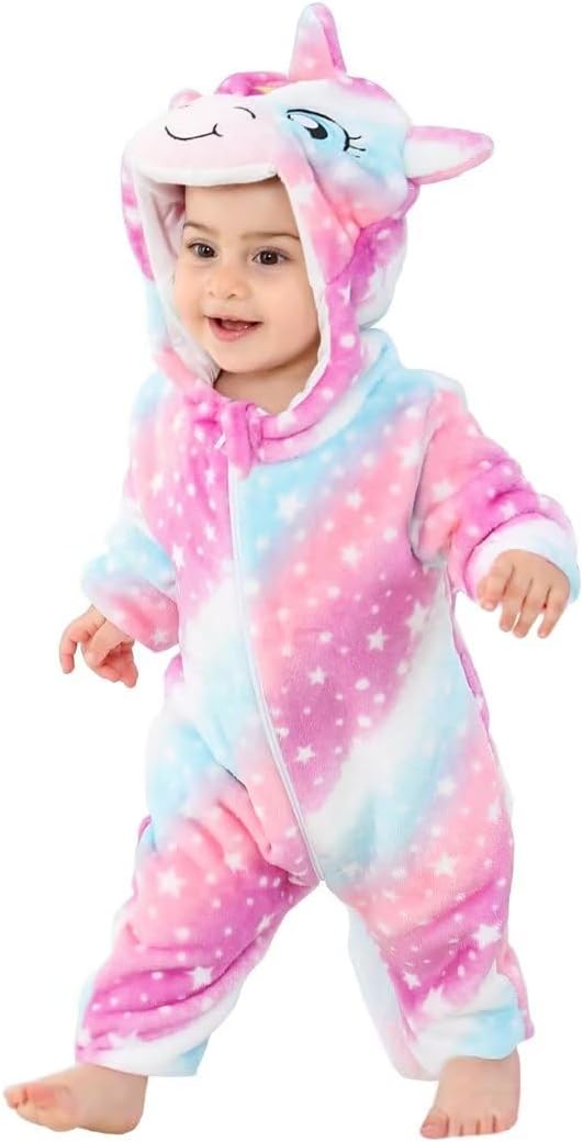 Toddler wearing a soft pink and blue star print unicorn romper with a hood that has a horn and ears.