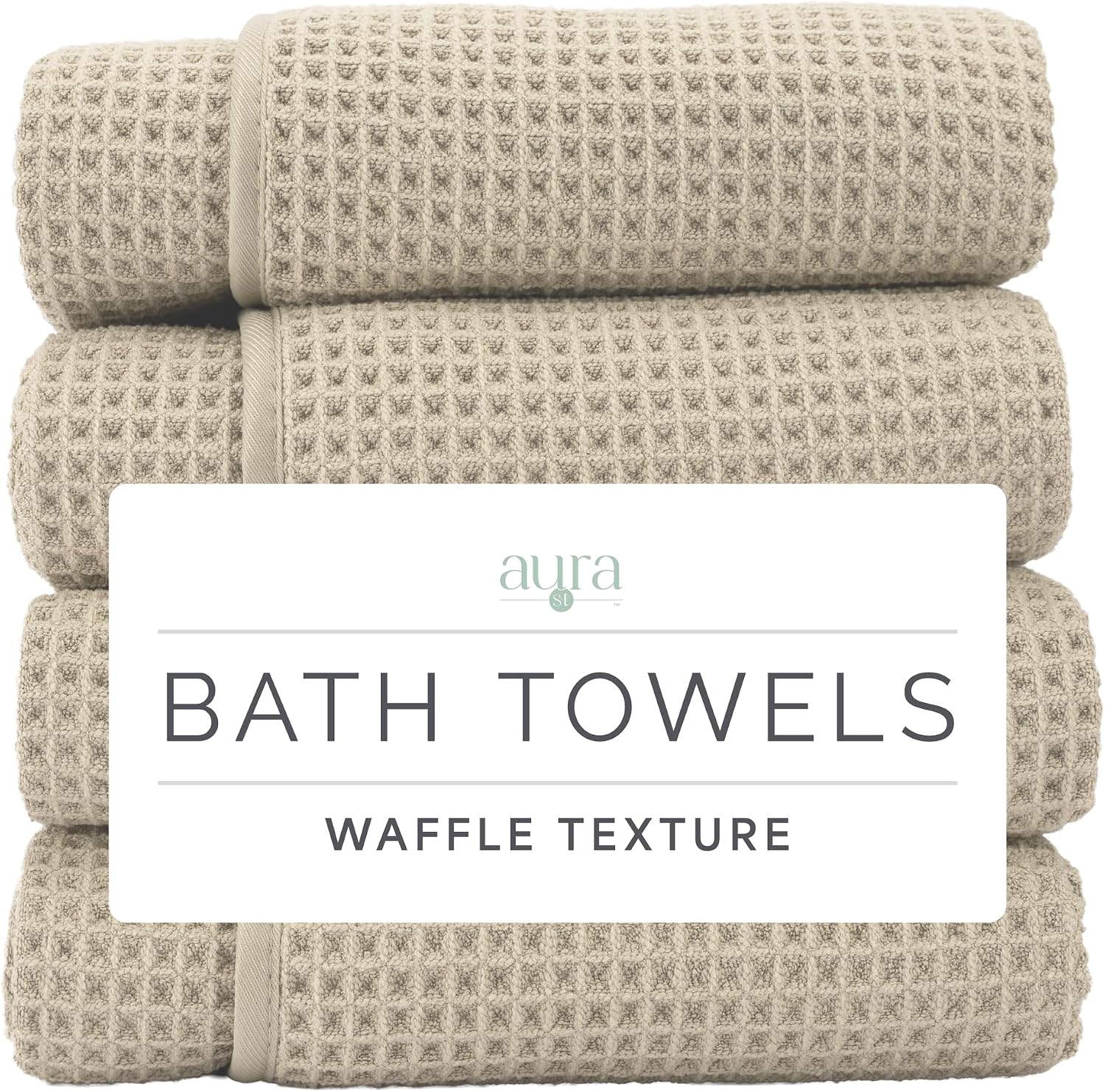 Stack of four rolled beige waffle-texture bath towels.