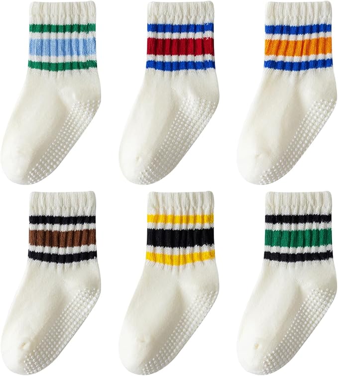 Six pairs of striped toddler crew socks with grip bottoms.