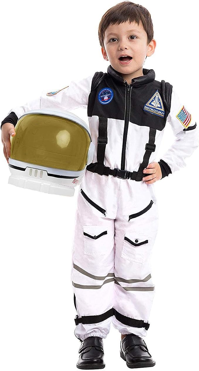 Toddler in a white and black astronaut suit holding a helmet with a gold visor.