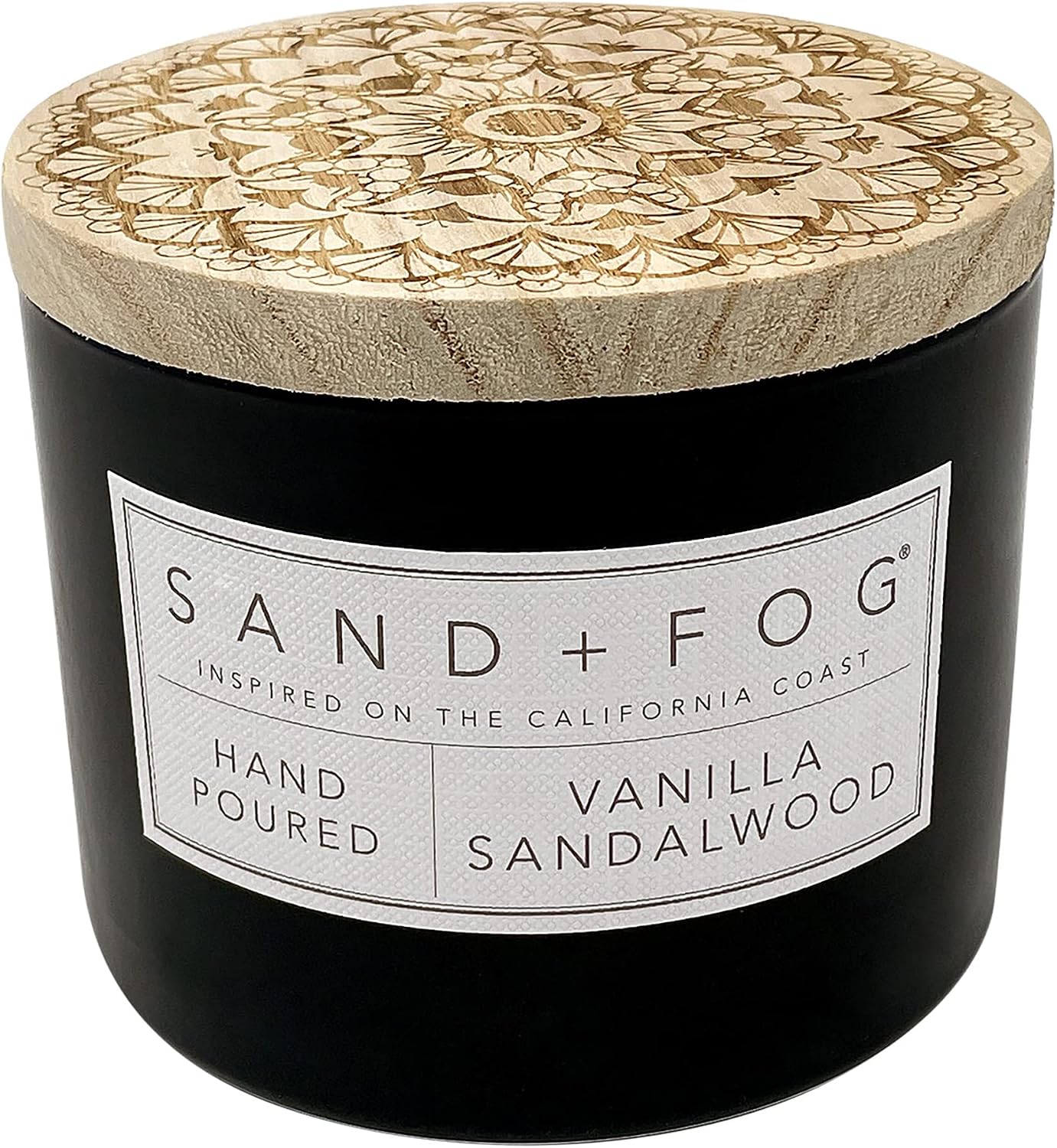 Black Sand + Fog vanilla sandalwood candle jar with a carved wooden lid.